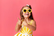 © Lisa Tichané - Funny little girl on pink background making funny face