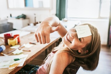 Sticky note on young girl forehead, homeschooling in the new normal