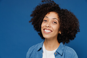 Wall Mural - Close up young smiling beautiful satisfied happy black woman in casual clothes shirt white t-shirt looking camera isolated on plain dark blue color background studio portrait People lifestyle concept