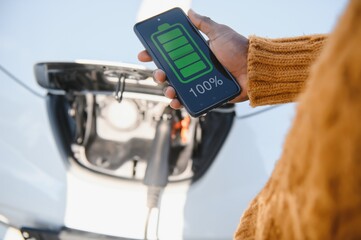 Phone charging in car concept, close up image of smart phone charger in car dashboard