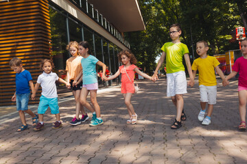 Wall Mural - The group of excited preschoolers are running together