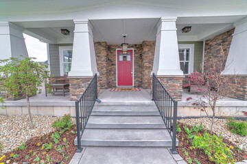 Wall Mural - Facade of a house with an inviting front porch and garden