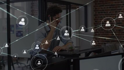 Poster - Animation of network of people icons over man on smartphone working with laptop in office