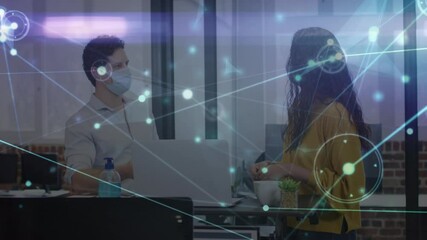 Poster - Animation of glowing network over male and female colleague in face masks talking in office