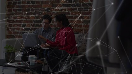 Poster - Animation of network over male and female colleague using laptop on couch in office