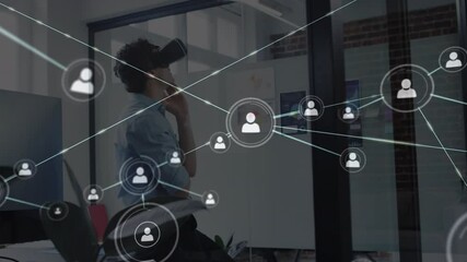 Poster - Animation of network people icons over businessman using vr headset in office