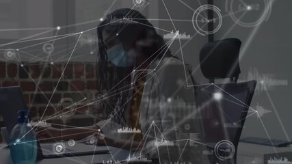 Poster - Animation of network and data processing over businesswoman in face mask working on laptop in office