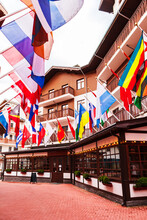 Alley Of Flags In The Rosa Khutor Resort. Mountain Olympic Village In The Caucasus Mountains.