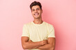 © Asier - Young caucasian man isolated on pink background who feels confident, crossing arms with determination.