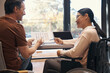 © Svitlana - Happy female with paraleria discussing business with man