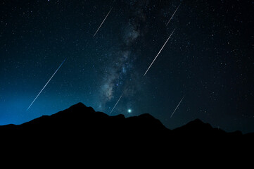 Poster - Panorama Milky Way. Night sky with stars and hooting stars with silhouette of dark the mountain. Space background