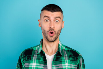 Poster - Photo of amazed shocked young man reaction news discount shopping isolated on blue color background