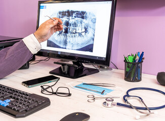 Wall Mural - Working table of a doctor with medical supplies and a computer