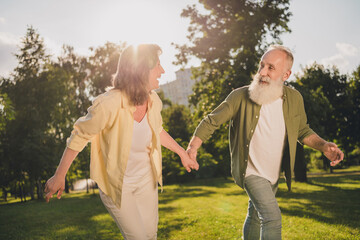 Poster - Photo of cheerful senior couple husband wife have fun love romance go run park summer nature outdoors