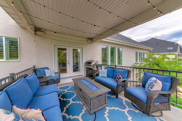 Wall Mural - Outdoor patio with blue themed color and string lights hanging on the ceiling