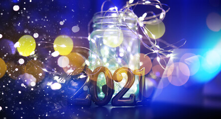 Holiday led light garland in jar with number 2021. Christmas, new year holiday celebration concept. Copy space.