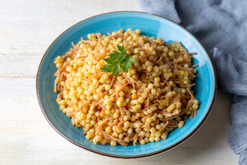 Traditional delicious Turkish food; Couscous pilaf with vermicelli (Turkish name; Sehriyeli kuskus pilavi)