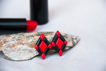 Wall Mural - Small red black earrings of polymer cly. Handmade jewelry.