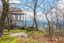 Single Family Mountain Vacation Rental House Wooden Deck On Stilts With Landscape View Overlook In Spring Springtime At Wintergreen Ski Resort Town City Of Nelson County, Virginia