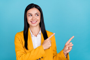 Wall Mural - Photo of dreamy inspired young business lady point fingers empty space idea cool isolated on blue color background