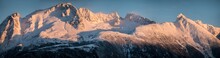A Panorama Photo Of The Mountains Above Haines, Alaska Lit Up By Alpenglow In Winter. 