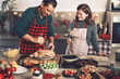© karepa - Man and woman cook together for Christmas traditional dinner