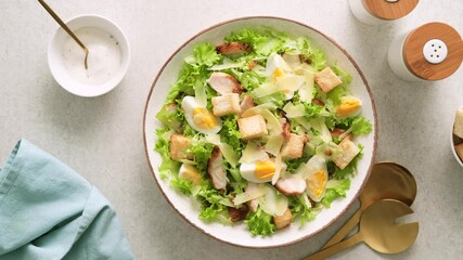 Sticker - Caesar salad with grilled chicken breast, hard-boiled egg, croutons, parmesan cheese, green salad lettuce and dressing