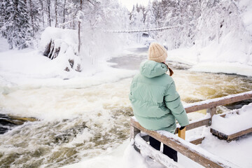 Canvas Print - Young girl enjoying winter landscape