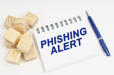 Aufkleber - On the table are cubes, a pen and a notebook with the inscription - Phishing Alert
