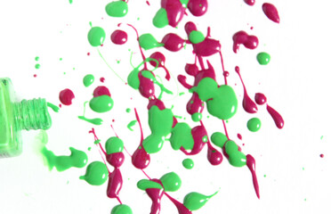 Canvas Print - Pink and Green Spilled Nail Polish on White Background