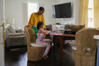 © Creative Flame - Mother and daughter using laptop at home