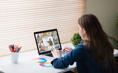 Poster - Caucasian girl using laptop for video call, with smiling diverse high school pupils on screen