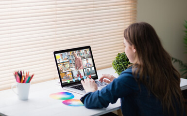 Poster - Caucasian girl using laptop for video call, with smiling diverse high school pupils on screen