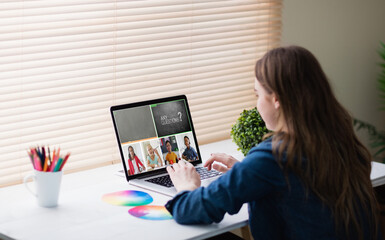 Poster - Caucasian girl using laptop for video call, with smiling diverse elementary school pupils on screen