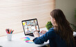 © vectorfusionart - Caucasian girl using laptop for video call, with smiling diverse elementary school pupils on screen
