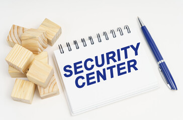 Poster - On the table are cubes, a pen and a notebook with the inscription - Security Center