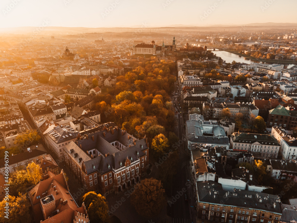 Sunrise view on Cracow main square and streets. Cracow, Lesser Poland province. St. Mary's Basilica, Rynek Glowny, Wawel castle