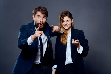 Wall Mural - business men and women in suits are standing next to the team