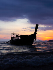 Wall Mural - Traditional long-tail boat on the beach in Thailand