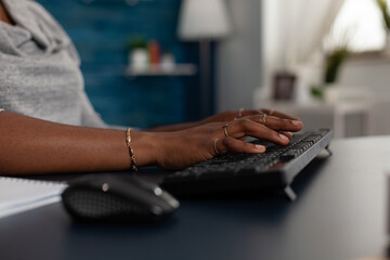 Poster - Close up of hands using keyboard to work on computer at desk. Young woman working on business project with modern device and technology at home, browsing online internet webiste.