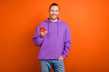 Sticker - Photo of funky millennial brown hairdo guy have telephone wear violet pullover isolated on orange color background