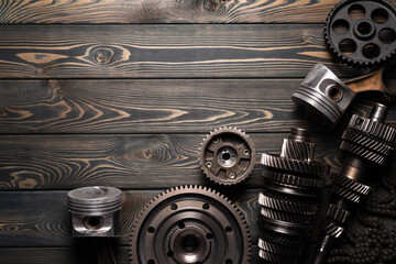 Wall Mural - Car spare parts on the wooden flat lay workbench background with copy space.