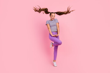 Poster - Photo of girlish pretty young lady wear striped t-shirt smiling dancing isolated pink color background