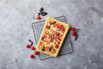 Wall Mural - Puff pastry tart with cherry tomatoes, mozzarella and purple basil