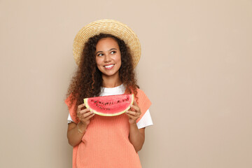 Poster - Beautiful young African American woman with slice of watermelon on beige background. Space for text