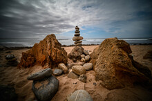 One Of Many Rock Cairns Among A Garden Along The Coast Of Portugal 