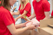 © zinkevych - Young people working in a donations distribution center