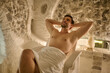 © zinkevych - A dark-haired man looking relaxed and enjoyed while spending time in a spa center