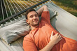 © zinkevych - Man napping in hammock in nature