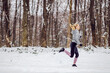 © dusanpetkovic1 - Happy fit sportswoman jogging in nature on snowy path at winter. Healthy habits, winter fitness, cardio exercises